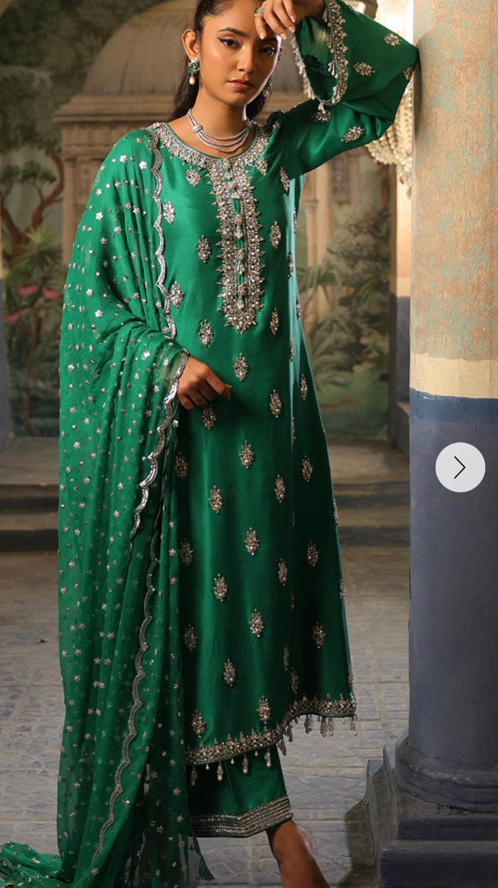 Nomi Ansari green suit
