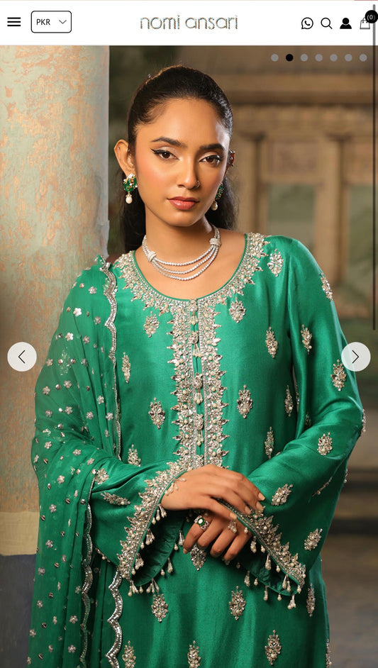 Nomi Ansari green suit
